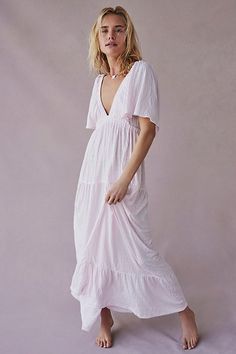 Forever free and flowy, this effortless maxi dress from our free-est collection is featured in a V-neck, tiered silhouette with flutter sleeves for added shape. * Soft, textured fabrication * Elastic empire waist * Effortless, pull-on style | La La Maxi Dress by free-est at Free People in Pink, Size: L Airy Flowy V-neck Dress, Beach Dresses With Crinkle Texture And Short Sleeves, Beach Dresses With Crinkle Texture, Short Sleeve Crinkle Texture Beach Dress, Chic Billowy Tiered Maxi Dress, Flowy V-neck Tiered Dress For Beach, Flowy V-neck Tiered Beach Dress, Flowy Tiered Breezy Maxi Dress, Feminine Flowy V-neck Tiered Dress