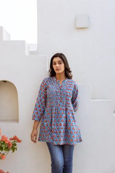 🌷  JAYALINI Add a splash of colour to your wardrobe with our Jayalini Tunic in vibrating floral motifs. Jayalini was created for a comfortable loose fit, and decorated with traditional hand block prints. Sizings: Size S:   Shoulders 38cm - 14.9" Bust  92cm - 36.2" Length approx. 72cm - 28.3" Size M:   Shoulders 40cm - 15.7" Bust  102cm - 40.1" Length approx. 72cm - 28.3" Size L:   Shoulders 42cm - 16.5" Bust  108cm - 42.5" Length approx. 72cm - 28.3" Size XL: Shoulders 43cm - 16.9" Bust  112cm White Bohemian, Splash Of Colour, Tunic Shirt, Cotton Fabrics, Floral Motifs, Ethical Fashion, Womens Clothing Tops, Color Splash, Printed Cotton