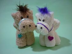 three stuffed animals are posed together on a green background