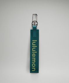 a keychain with the word ummeron on it hanging from a hook