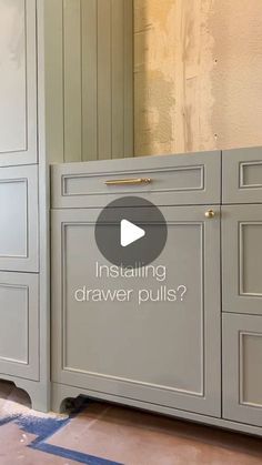 a kitchen cabinet with the words installing drawer pulls? in front of it and an image of