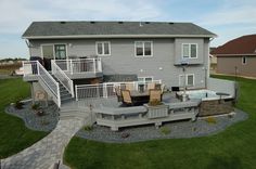 a house with a patio and hot tub in the yard