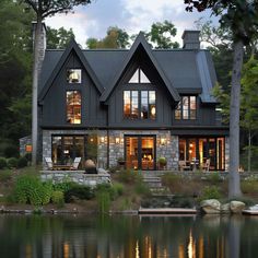 a large house sitting on top of a lake