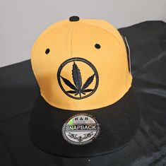 Weed Logo Snapback. Color Yellow And Black. Never Worn. New With Tags. Trendy Yellow Snapback Hat, Trendy Yellow Hat For Streetwear, Trendy Yellow Streetwear Hat, Yellow Casual Snapback Hat, Yellow Adjustable Flat Bill Snapback Hat, Yellow Flat Bill Hat, One Size Fits Most, Yellow Flat Bill Hat, Trendy Yellow Baseball Cap Snapback Hat, Trendy Yellow Snapback Baseball Cap