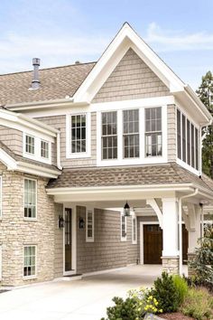 a large house with lots of windows and white trim