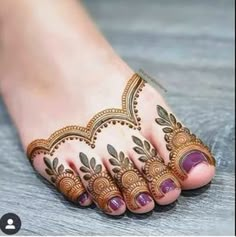 the feet are decorated with henna designs