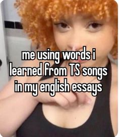 a girl with red hair and an orange wig saying me using words i learned from t's songs in my english essays