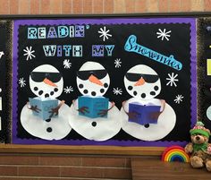 a bulletin board with snowmen reading books