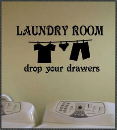 laundry room wall decal with clothes hanging on the line and dryer below it