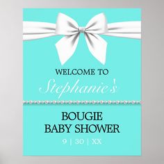 a welcome sign for a baby shower with a white bow on the front and blue background