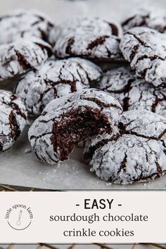 chocolate crinkle cookies on a cooling rack with text overlay that reads easy sourdough chocolate crinkle cookies