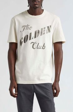 Go golden in this lightly distressed cotton T-shirt that's stamped with vintage-inspired logo lettering. Crewneck Short sleeves 100% cotton Machine wash, line dry Made in Italy Designer Clothing Gold Cotton Tops With Logo Print, Gold Cotton T-shirt With Text Print, Vintage Gold Top With Graphic Print, Vintage Gold Tops With Graphic Print, Gold Vintage Tops With Graphic Print, Gold Cotton T-shirt With Graphic Print, Relaxed Fit Gold Cotton Top, Gold Crew Neck Cotton T-shirt, Gold Cotton Top With Relaxed Fit