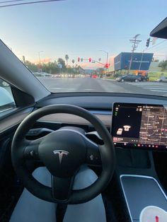 the dashboard of a car with a laptop on it