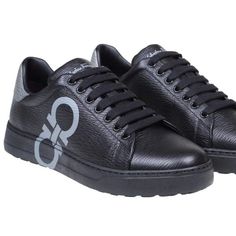 Salvatore Ferragamo Gancini-Logo Printed Lace-Up Sneakers Men's Black 12 $660. Dimensions: Heel: 1cm 100% Leather Made In Italy Designer Model Number: Numbernero Designer Colour: Black New Season Fw22 Calfskin Sneakers Black Colour Grained Leather Finish Gancini Logo On The Side Model With Round Tip Contrasting Heel Closure With Laces Leather Interior Rubber Sole Calfskin Composition Made In Italy Made In: Italy Luxury Wingtip Calf Leather Sneakers, Designer Calf Leather Sneakers With Textured Sole, Luxury Black Plain Toe Sneakers, Luxury Calf Leather Sneakers For Formal Occasions, Elegant Black Calf Leather Sneakers, Luxury Sneakers With Leather Sole And Plain Toe, Designer Calf Leather Sneakers With Embossed Logo, Designer Sneakers With Leather Sole, Designer Low-top Custom Sneakers For Formal Occasions