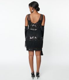 This elegant flapper aesthetic cocktail dress sparkling with iridescent sequins throughout the black mesh over black lining. Complete with an illusion neckline, tiered fringe, and secured with a back zipper. Style Runs Small; Please Consider Sizing UpAvailable in sizes S-3X while supplies last. Flapper Aesthetic, Uv Clothing, 1920s Outfits, Black Iridescent, Flapper Costume, Iridescent Sequin, Illusion Neckline, Vintage Branding, Unique Dresses