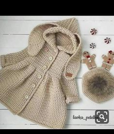 a crocheted coat, hat and booties are shown