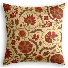 a decorative pillow with red flowers on it