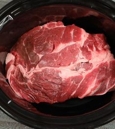 raw meat in the slow cooker ready to be cooked