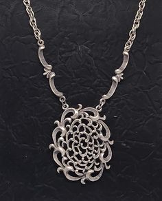 Discover the charm of the past with this Vintage Gothic 1973 Amway Spanish Scroll Necklace. Crafted in stunning silver tone, this necklace features an elaborate scroll design that beautifully captures the essence of Gothic aesthetics. The intricate detailing on the pendant combined with the elegant chain makes it a standout piece for any jewelry collection. DETAILS:     Brand: Amway     Year: 1973     Style: Gothic Spanish scroll design     Material: Silver-tone metal     Length: Approximately 18 inches     Condition: Excellent vintage condition with minimal wear This necklace is not only a lovely addition to your jewelry collection but also a fantastic gift for those who appreciate vintage style. Vintage Gothic Jewelry, Style Gothic, Vintage Gothic, Jewelry Statement, Scroll Design, Neck Piece, Gothic Jewelry, Fantastic Gifts, Necklace Silver