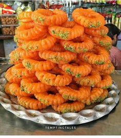 there is a plate full of food that looks like pretzels on top of each other