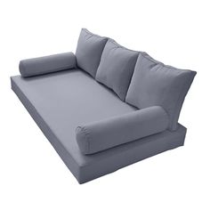 a large gray couch sitting on top of a white floor