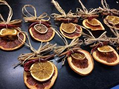 orange slices are tied with twine and placed on top of each other for decoration