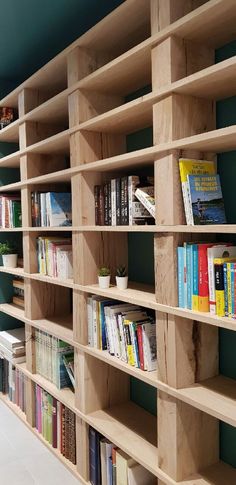 the bookshelf is made out of wooden planks