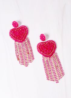 Get ready to make a statement in this beaded heart earring. It features accent rhinestone fringe and is on a post back. Dimensions: 3.75" long Beaded Dangle Heart Earrings For Parties, Dangle Beaded Earrings With Heart Beads For Party, Fringe Earring, Beaded Heart, Rhinestone Fringe, Heart Earring, Fringe Earrings, Heart Earrings, Get Ready