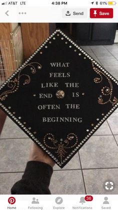 someone holding up a graduation cap that says, what feels like the end is often the beginning