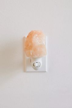 a light switch with a piece of food on it