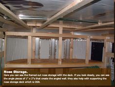 the inside of a storage room with lots of wood