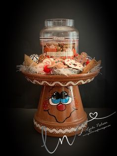 a cake stand filled with lots of different types of cookies and pastries on top of it