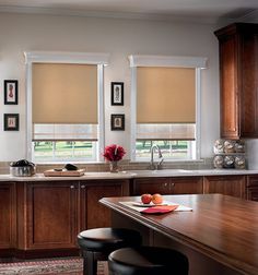 a kitchen with wooden cabinets and counter tops