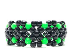 Alien Ooze Kandi Bracelet Made with Black & Green Pony Beads Choose Your Cuff Size By Choosing Your Bead Length Cuff Sizes - X Small 30 Bead Length - Small 33 Bead Length - Medium 36 Bead Length - Large 39 Bead Length - X Large 42 Bead Length We Accept Custom Orders ! Kandi Crafts, Edc Accessories, Pony Bead Jewelry, Rave Kandi, Kandi Inspo, Diy Kandi Bracelets, Pony Bead Bracelets, Diy Kandi, Kandi Kid