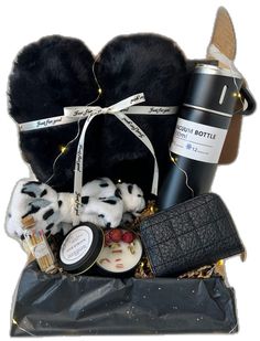 a black gift bag filled with various items