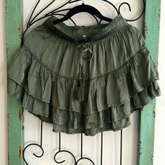 Aerie Miniskirt Size Xs Nwot Beautiful Silk Like Material Bohemian Vibe Olive Green Color Ruffles Tassel Tie To Waist Bohemian Short Mini Skirt For Spring, Casual Green Mini Skirt For Vacation, Flowy Casual Mini Skirt, Bohemian Style Flowy Skirted Skort, Bohemian Short Mini Skirt, Bohemian Style Short Mini Skirt, Bohemian Style Flowy Skort, Bohemian Mini Bottoms With Elastic Waistband, Bohemian Mini Skirt For Spring