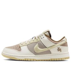 As we celebrate The Year of the Rabbit, Nike has gone all out with four dunk lows carrying the Chinese New Year theme. The recent revealal of the earth-tone and off-white colorway flexing a soft chenille Swoosh appearing in cream and a rabbit motif embroidered at the heel. The dunks also come in white/red, blue/red/white and brown/orange/bordeaux. FD4203-211 (SNKR/Skate/Unisex/Low Top/Non-Slip/Wear-resistant) Chinese New Year Theme, Year Of The Rabbit, Dark Taupe, Nike Sb Dunks, Shades Of Brown, Round Toe Heels, The Rabbit, Dunk Low