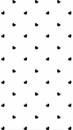 a black and white pattern with hearts on it