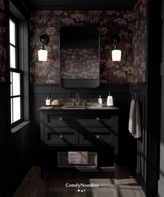 a black bathroom with floral wallpaper and dark wood flooring is featured in this image