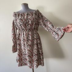 This vintage 1960s/1970s babydoll number was sourced in Virginia Beach, Virginia! It is a larger size and can be worn either as a minidress or as a tunic top, depending on what length you are comfortable with! The (possibly homemade) dress is made of a thicker cotton fabric with an off-white base and red and blue paisley patter. The collar is elasticsted and can either be worn as a large scoop neck or off the shoulder, Bardot style. The long sleeves have elastic at the wrists that then open into bell shaped cuffs. The empire waisted under-bust is elasticated and  opens into an A-line silhouette with open waist and hips.   Measurements and details: Total Length: 34 in Shoulder to shoulder: 14 in Sleeve length: 22 in  Bust: 40 in Under-bust: 30 in (unstretched) to 44in (stretched to max) Wai Homemade Dress, Virginia Beach Virginia, Bardot Style, Baby Doll Dress, Blue Paisley, Virginia Beach, Babydoll Dress, Vintage 1960s, Dress Clothes For Women