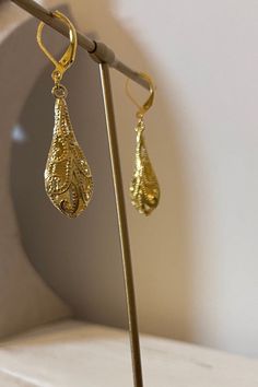 These earrings are gorgeous. They are gold detailed cutout teardrop earrings. They measure 2 inches long with a 1 1/2 inch drop. They are gold filled and are leverback earlobe closures. They are just so pretty and would make a great earring for dressing up or dressing down. Think of these as a gift idea for the holidays or a gift for yourself. Thank you for looking! Gold Teardrop Pendant Earrings With Ear Wire, Gold Hypoallergenic Teardrop Chandelier Earrings, Elegant Gold Teardrop Pendant Earrings, Gold Teardrop Earrings With Lever Back As Gift, Gold Teardrop Earrings As Gift, Gold Long Drop Teardrop Earrings, Gold Long Drop Teardrop Earrings For Pierced Ears, Ornate Teardrop Earrings With Ear Wire, Gold-plated Hypoallergenic Teardrop Earrings