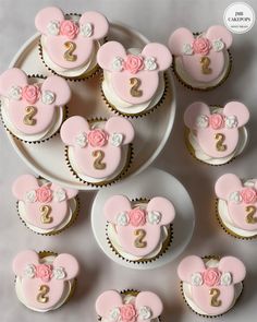 cupcakes decorated with pink and gold minnie mouse ears