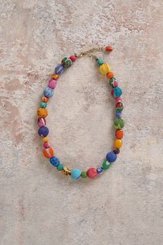 Designed to complement the tones of our latest Tapestry collection, the Neon Kantha Necklace has been crafted exclusively for Blue Illusion by artisans in India as part of World Finds, a Fair Trade project empowering women and girls. With vibrant multicoloured beads made from recycled saris and upcycled wood, this piece supports the ongoing life of traditional handicrafts while supporting women to thrive within their communities. Discover a world of colour with our Kantha collection. Fair Trade Multicolor Round Bead Jewelry, Artisan Multicolor Beaded Necklace, Multicolor Wooden Beads For Festival, Artisan Multicolor Adjustable Beaded Necklaces, Adjustable Multicolor Artisan Beaded Necklaces, Adjustable Multicolor Wooden Beaded Necklaces, Multicolor Fair Trade Necklace With Round Beads, Artistic Multicolor Necklaces With Large Beads, Multicolor Artisan Beads For Festival