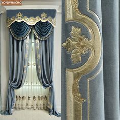 an ornate window with blue curtains and gold trim