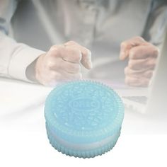 a person using a blue device on top of a table