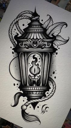 an ink drawing of a lantern with flowers and leaves on the bottom half of it