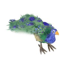 a blue and green bird is flying in the air with its tail feathers spread out