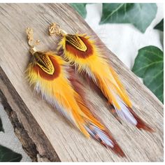 Silver or gold funky & quirky bohemian long feather earrings with stripy brown, white & sunshine yellow feathers Carefully handmade from unique real feathers. Beautiful big colorful statement accessories for summer music festivals, BBQs, parties or outdoor weddings! They are very soft and flexible.   Feathers: 10-12cm (4-5") These fun boho hippie dangle earrings are lightweight and comfortable to wear, and are made with silver or gold plated earring hooks, huggie leverback hoops or clip-ons.  Se Yellow Summer Festival Jewelry, Multicolor Feather Jewelry For Festivals, Handmade Hippie Gold Jewelry, Bohemian Single Earring For Summer, Unique Yellow Dangle Jewelry, Adjustable Yellow Bohemian Jewelry, Yellow Bohemian Adjustable Jewelry, Summer Single Yellow Earring, Trendy Brown Jewelry For Summer