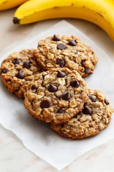 three oatmeal cookies with chocolate chips and bananas