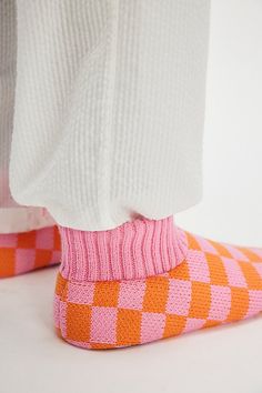 Jazz up your days in with these playful slippers, featured in an ankle-length knit style and fun checkerboard print. **Features:** Ankle length, knit uppers, round toe, sock-like design, ribbed cuff, flat outsole with non-slip grips, checkerboard print **Why We | Sleepover Bootie Slippers by FP Collection at Free People in Orange, Size: US 8 Bootie Slippers, South Beach, Boho Outfits, Ankle Length, Bootie, Free People, Slippers, Cuff, Orange